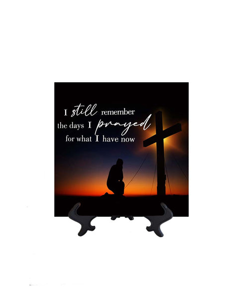 8x8 I still remember - inspirational quote with kneeling man in front of cross with orange sunset backdrop on ceramic tile & stand with no background