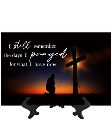 Main I still remember - inspirational quote with kneeling man in front of cross with orange sunset backdrop on ceramic tile & stand with no background
