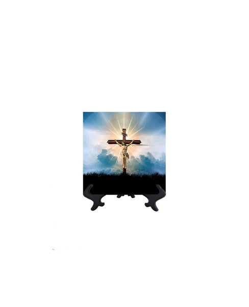 4x4  Christ crucified on ceramic tile with blue clouds & sky & sun's golden rays as a backdrop. Ceramic tile on stand & no background