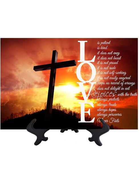 Main Love is Patient white text bible quote with cross & sun's rays as backdrop on ceramic tile & stand & no background