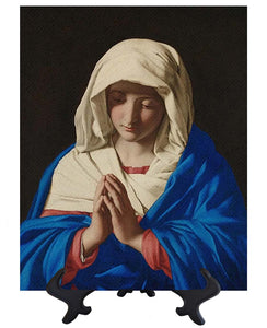 Main The Virgin Mary deep in prayer with folded hands on stand & no background