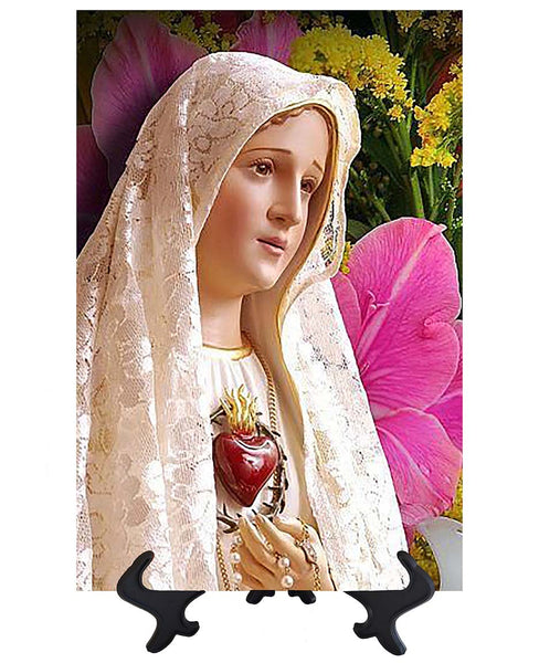 Main Immaculate Heart of Mary statue with backdrop of beautiful flowers & no background